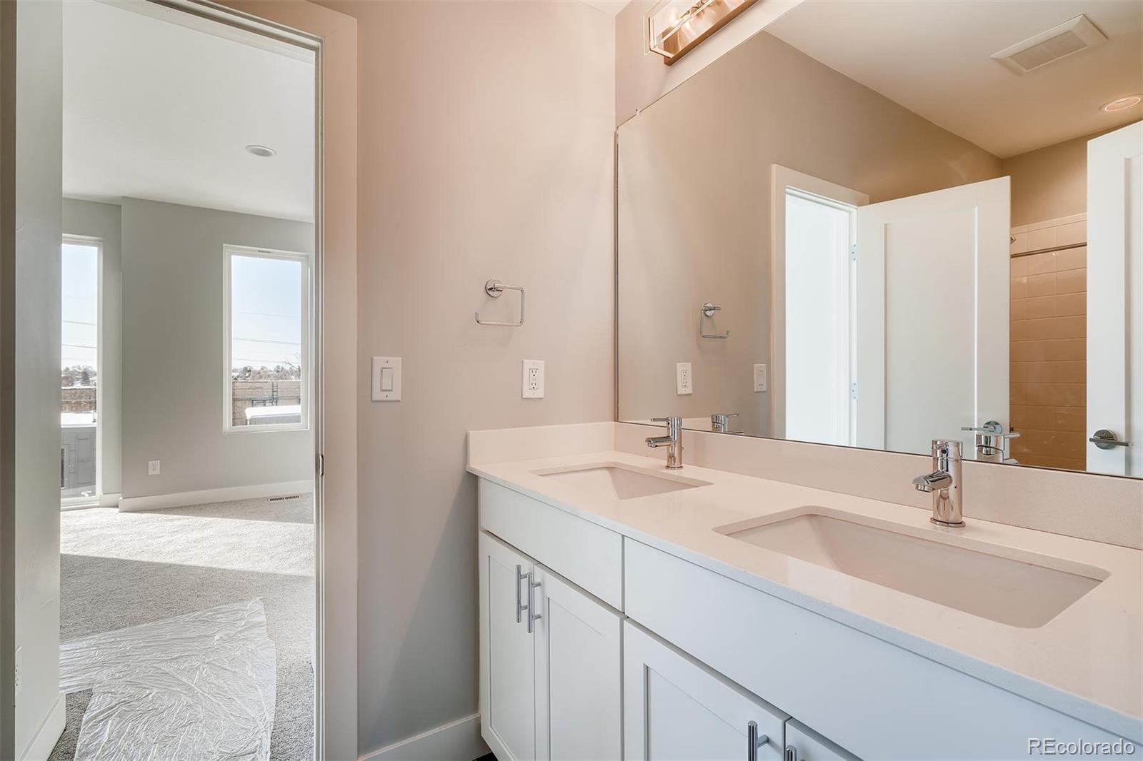 1237 Perry Street Denver, CO 80204 - Photo 21 of 37 a bathroom with a sink and a mirror