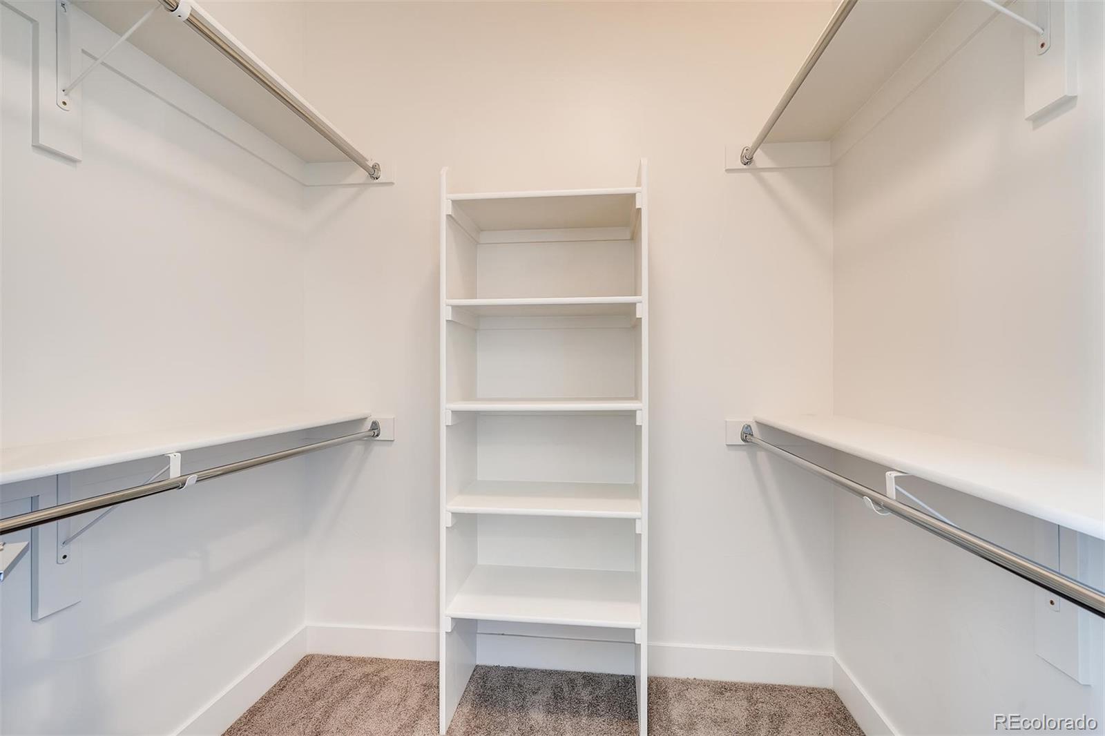 1237 Perry Street Denver, CO 80204 - Photo 23 of 37 a view of walk in closet with empty racks