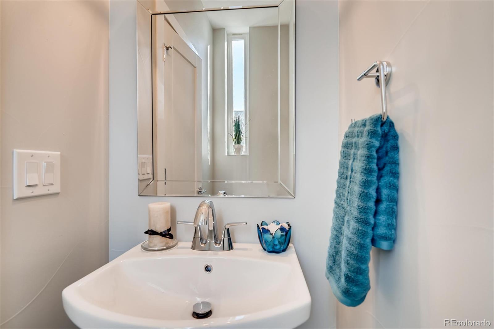 1237 Perry Street Denver, CO 80204 - Photo 10 of 37 a bathroom with a sink and a mirror