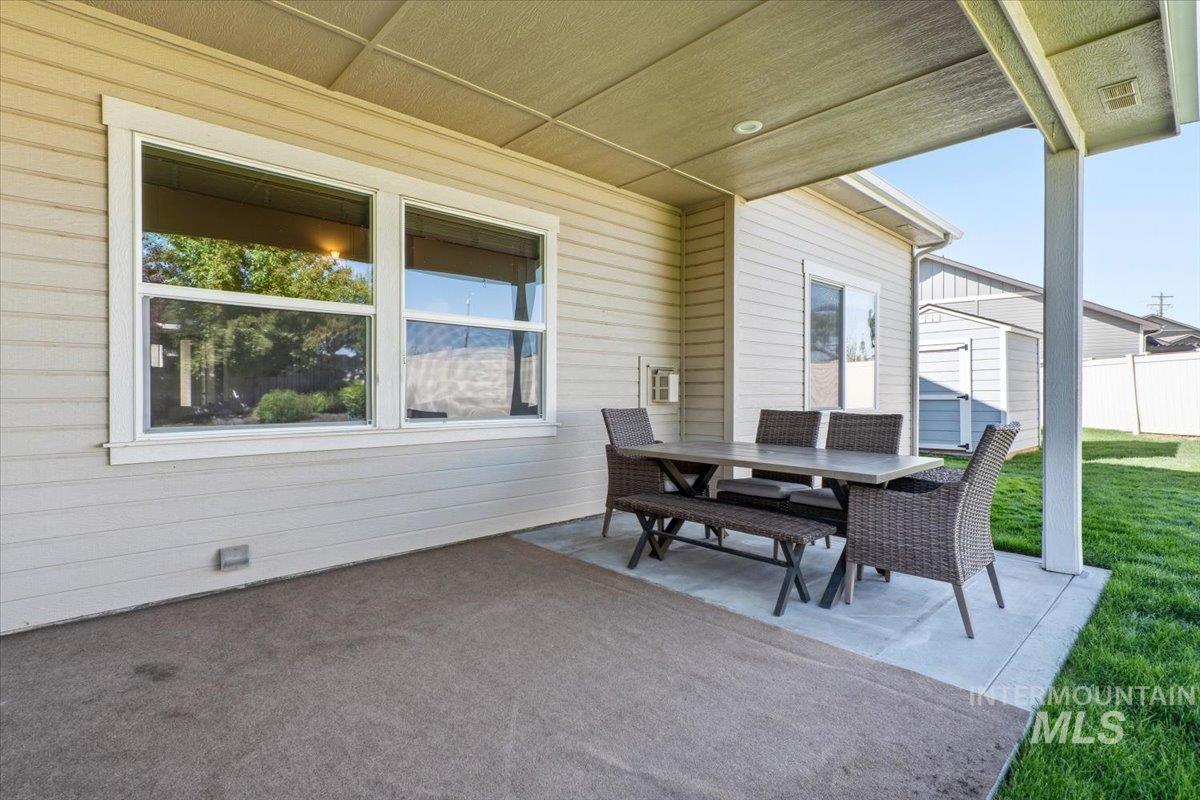 1183 North Buffalo Way Middleton, ID 83644 - Photo 34 of 47 Covered patio featuring a concrete slab and overhead lighting