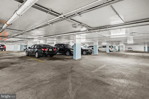a view of parking garage with cars