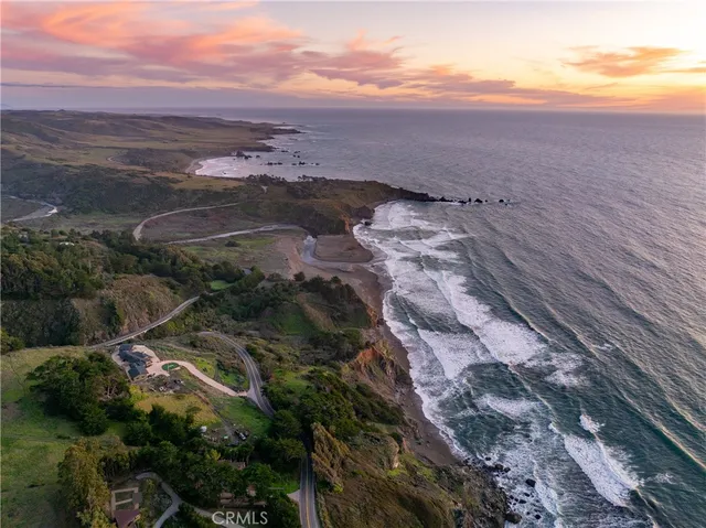 a view of a lake with mountains in the background