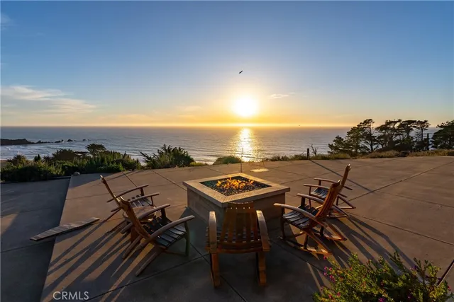 a view of a large house with a mountain yard and a mountain view