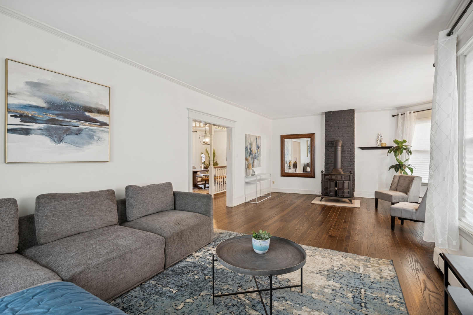 138 Clinton Avenue, Unit 2 Oak Park, IL 60302 - Photo 2 of 12 a living room with furniture and wooden floor