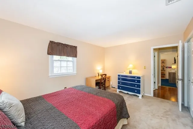 a bedroom with a bed and a cabinets