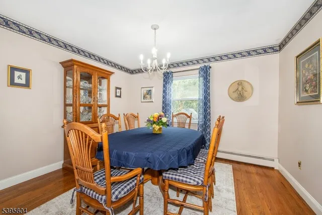 a view of a dining room with furniture and window