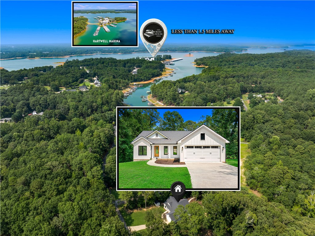 An aerial perspective showcases a new residence nestled amidst lush green forests with water access nearby.