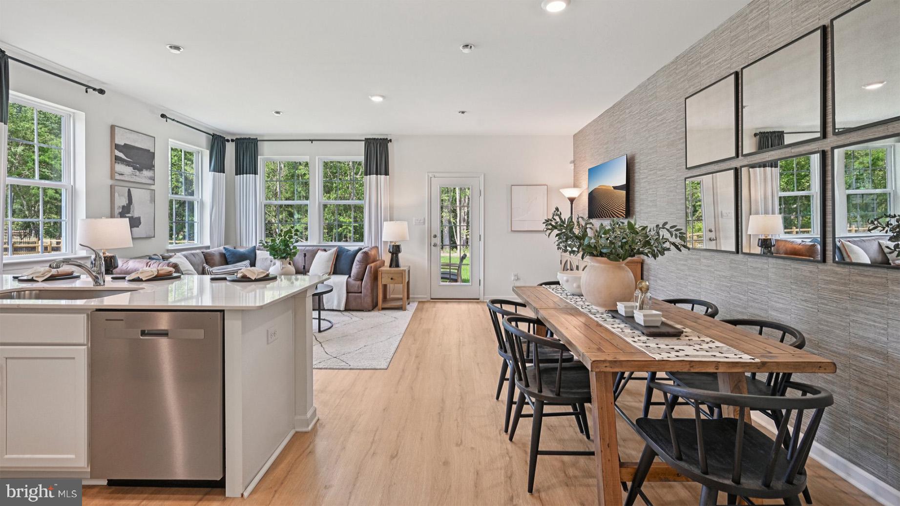 7 Reagan Drive Runnemede, NJ 08078 - Photo 9 of 48 a view of a dining room with furniture large windows and wooden floor