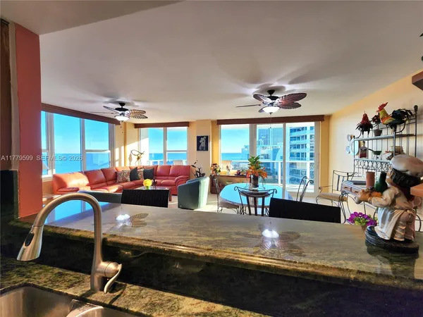 a living room with a bed furniture and a window