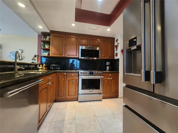 a bathroom with a sink vanity mirror and toilet