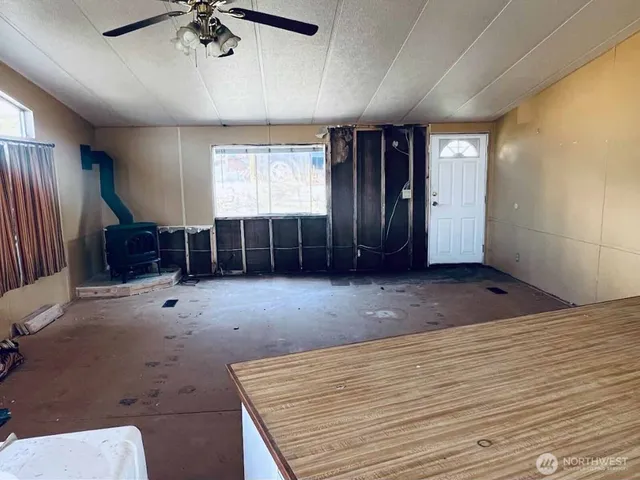 a view of an empty room with a window