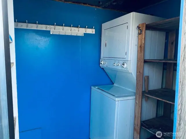 a view of a hallway with wooden shelves