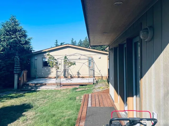 a view of yard with patio