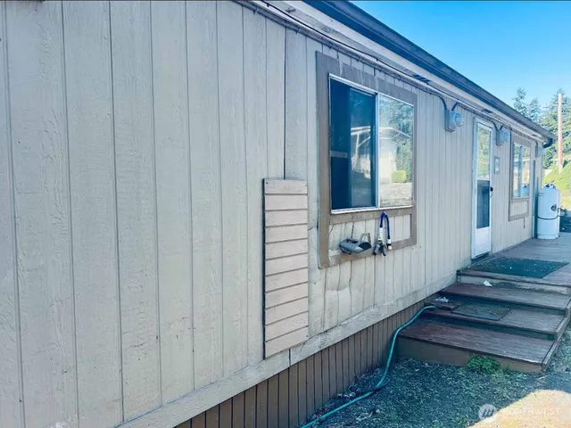 a view of a balcony with wooden floor