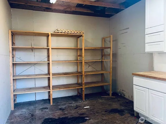 a view of storage and utility room with washer and dryer