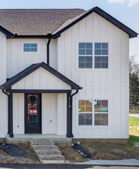 a front view of a house with a yard