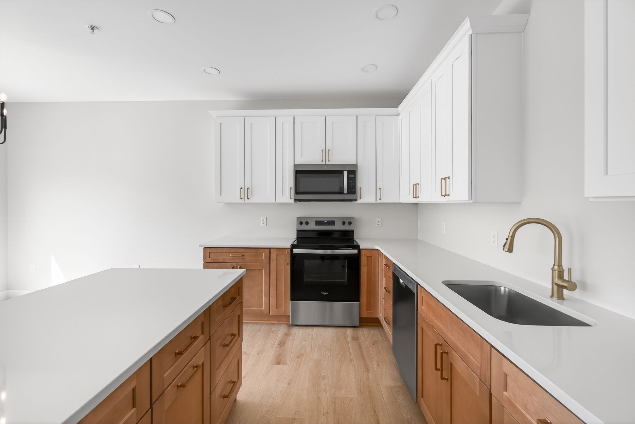 216 West Jere Whitson Road Cookeville, TN 38501 - Photo 15 of 31 a kitchen with a sink and a stove top oven with wooden floor