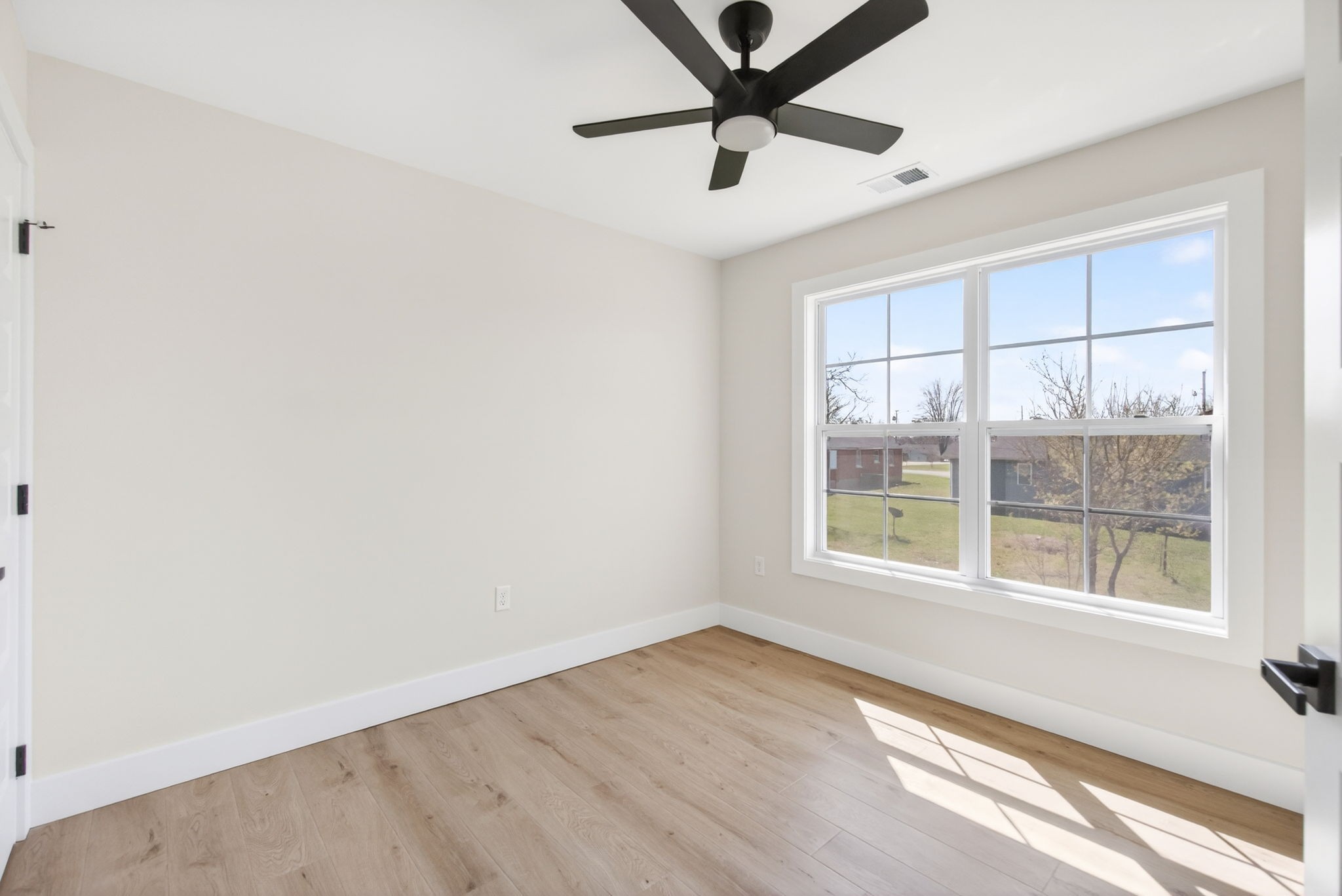 216 West Jere Whitson Road Cookeville, TN 38501 - Photo 23 of 31 an empty room with a window and a ceiling fan
