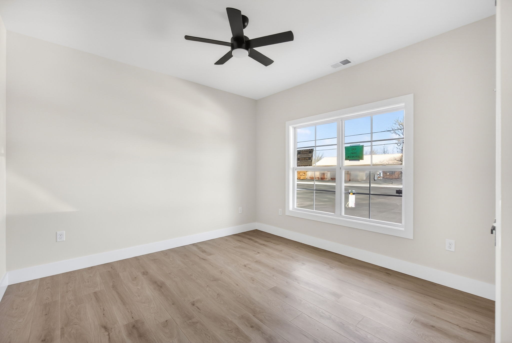 216 West Jere Whitson Road Cookeville, TN 38501 - Photo 10 of 31 wooden floor in an empty room with a window