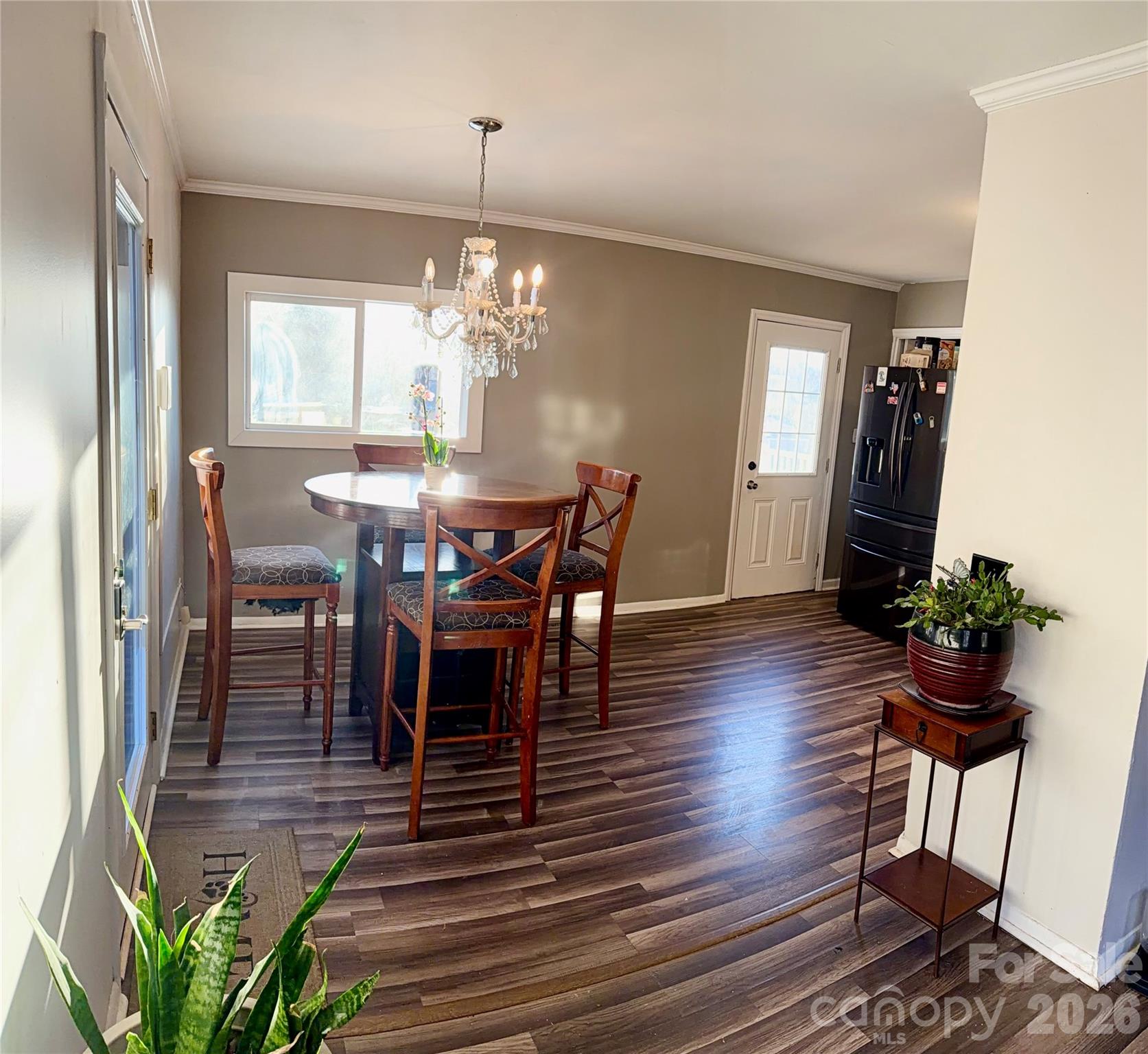 433 Brevard Street Statesville, NC 28677 - Photo 11 of 33 a view of a dining room with furniture window and wooden floor
