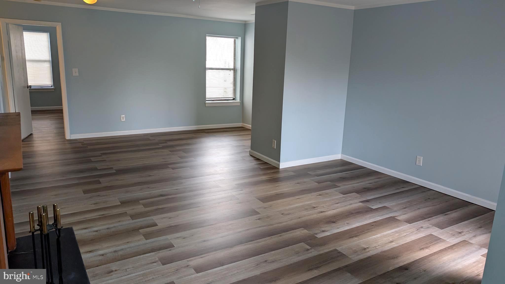 13402 Shady Knoll Drive, Unit 13402 Silver Spring, MD 20904 - Photo 5 of 22 a view of a room with wooden floor and a window