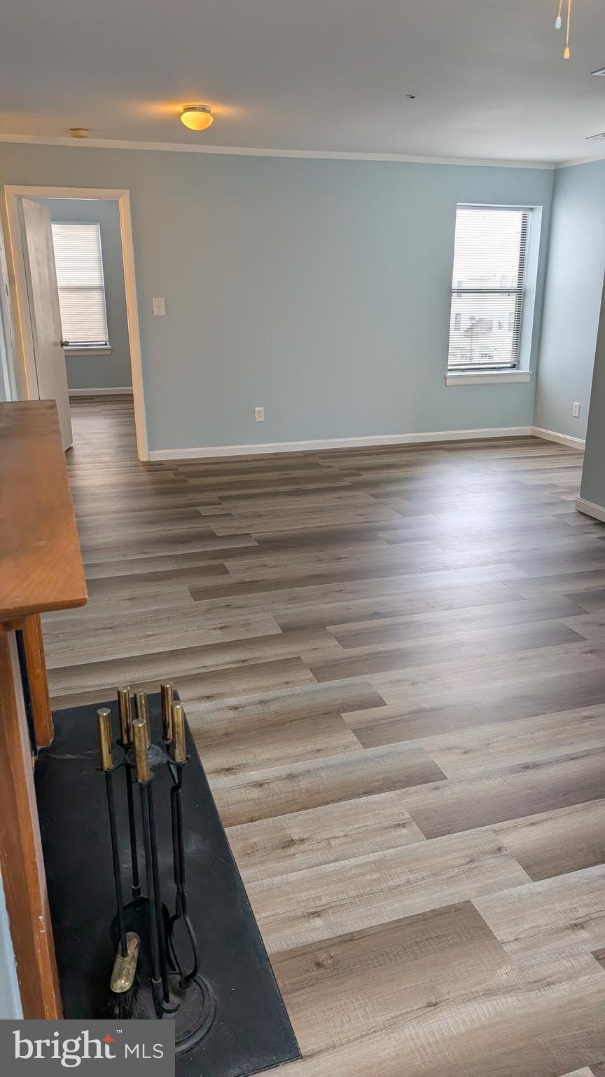 13402 Shady Knoll Drive, Unit 13402 Silver Spring, MD 20904 - Photo 7 of 22 a view of entryway and hall with wooden floor