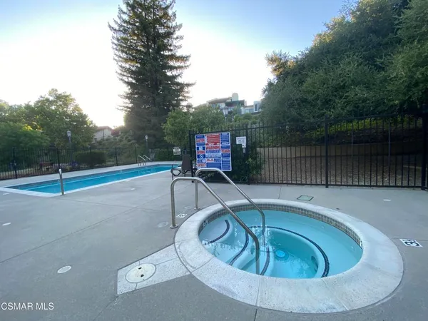 a view of swimming pool having outdoor seating