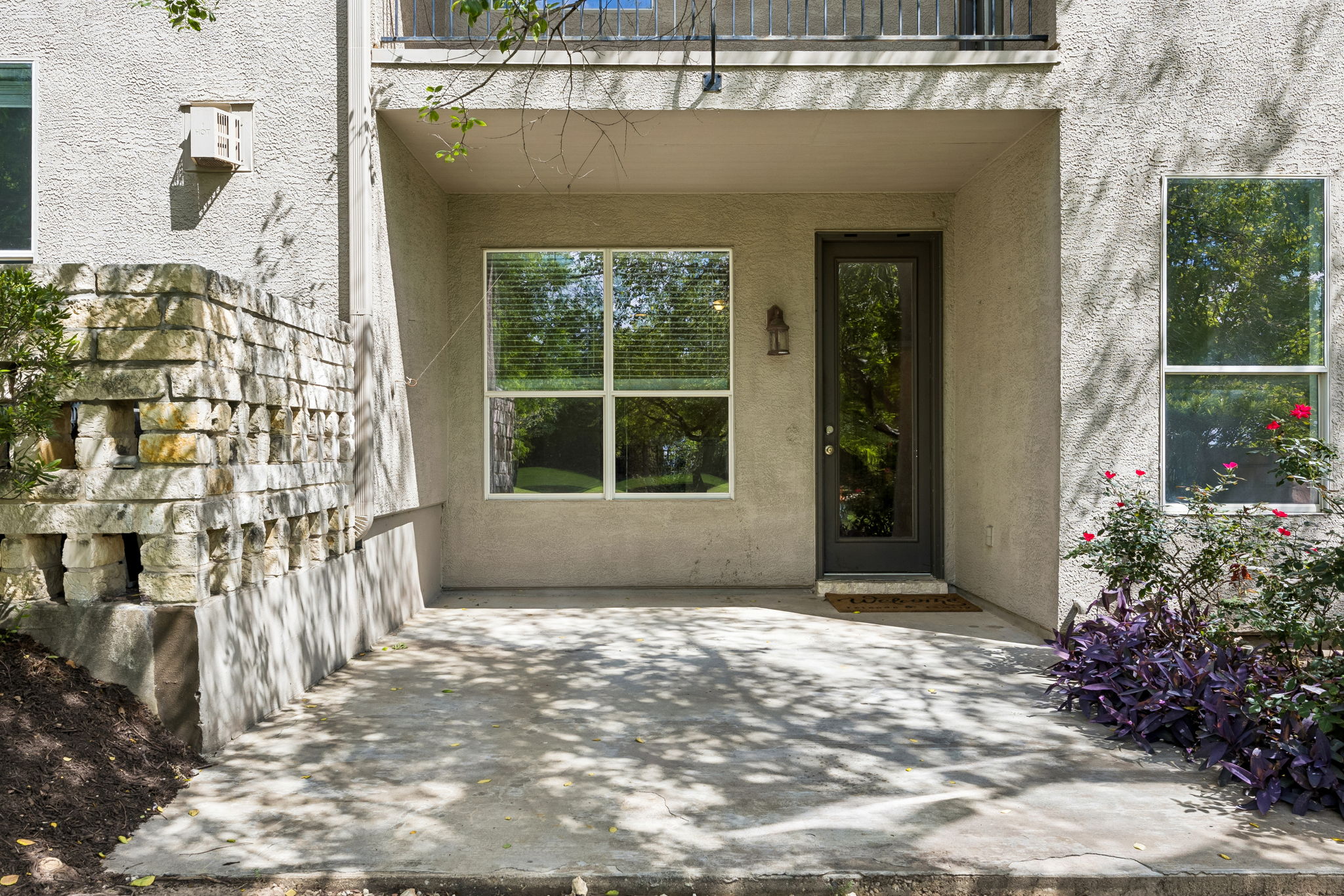 114 Aria Ridge, Unit 802 Lakeway, TX 78738 - Photo 33 of 37 A secluded patio retreat offers tranquil outdoor living.