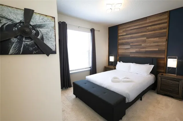 a large white bed in a white room