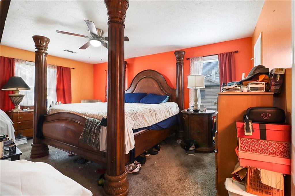 4494 Huntsman Bend Decatur, GA 30034 - Photo 15 of 27 a bedroom with a bed and dresser with mirror