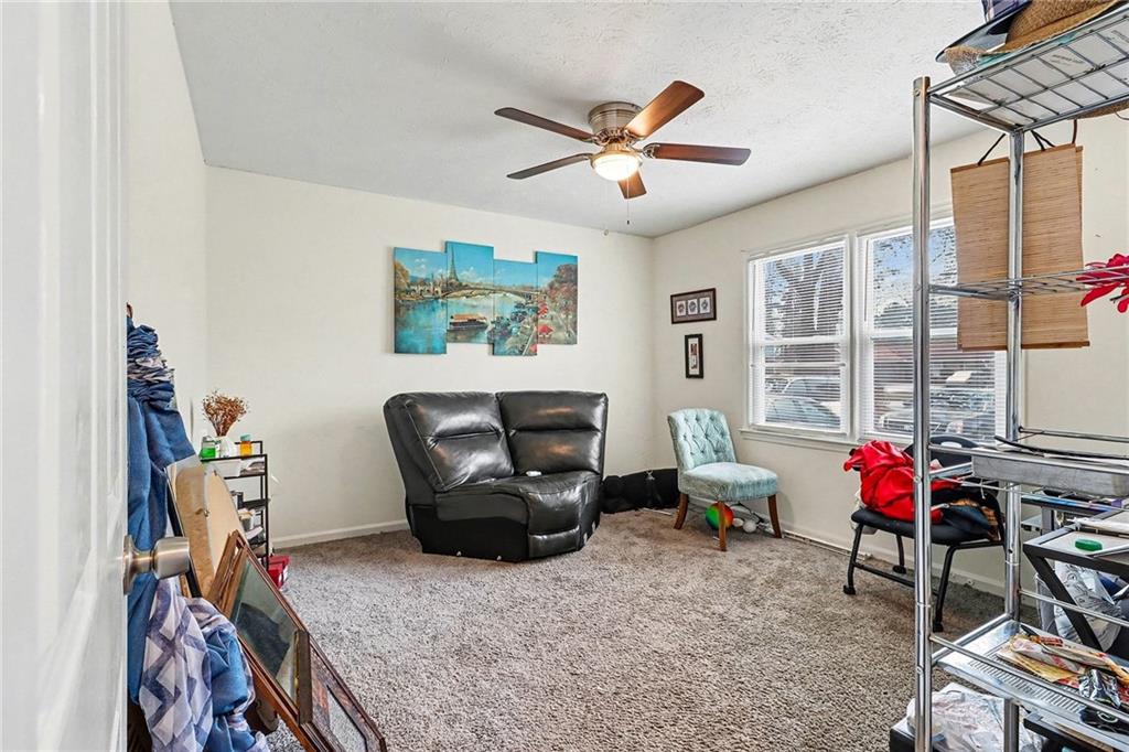 4494 Huntsman Bend Decatur, GA 30034 - Photo 22 of 27 a living room with furniture a flat screen tv and a window