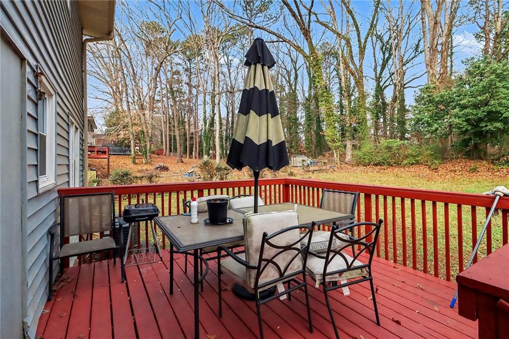 4494 Huntsman Bend Decatur, GA 30034 - Photo 24 of 27 a view of balcony with wooden floor and outdoor seating