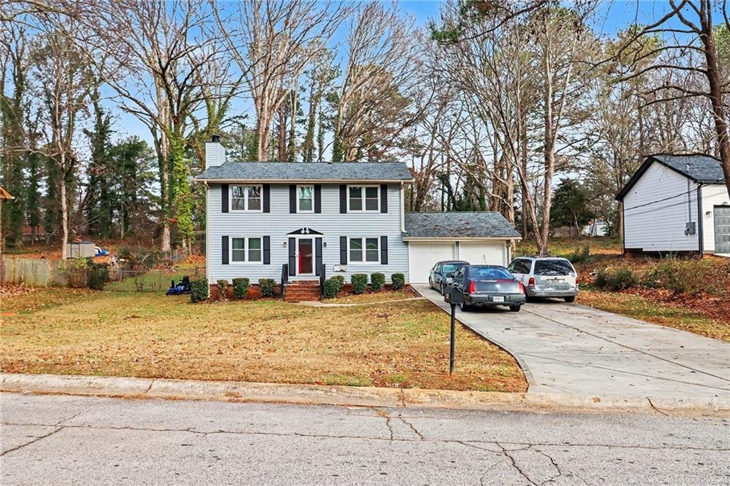 4494 Huntsman Bend Decatur, GA 30034 - Photo 3 of 27 a view of a white house with a large tree in front of it