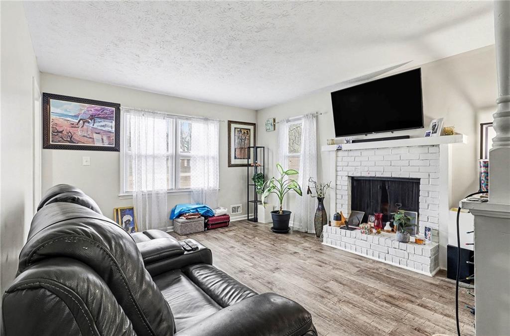4494 Huntsman Bend Decatur, GA 30034 - Photo 6 of 27 a living room with furniture fireplace and flat screen tv