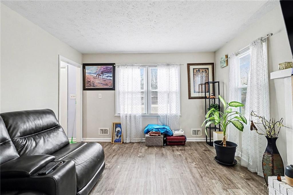 4494 Huntsman Bend Decatur, GA 30034 - Photo 7 of 27 a living room with furniture and a potted plant
