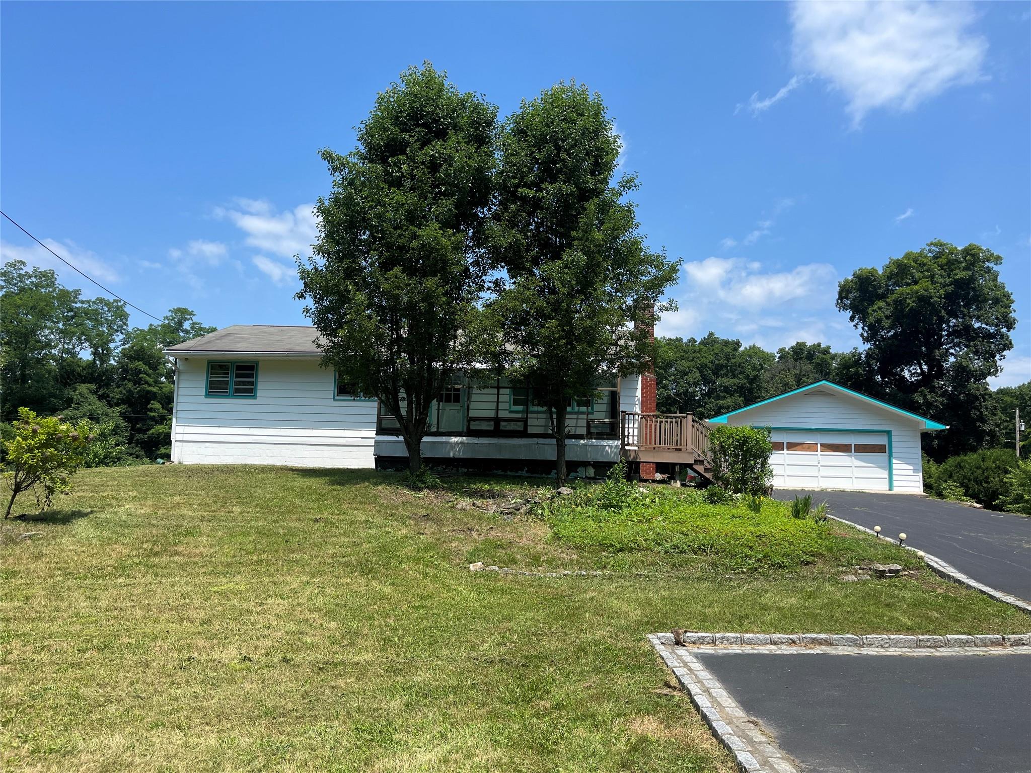 a backyard of a house with lots of green space