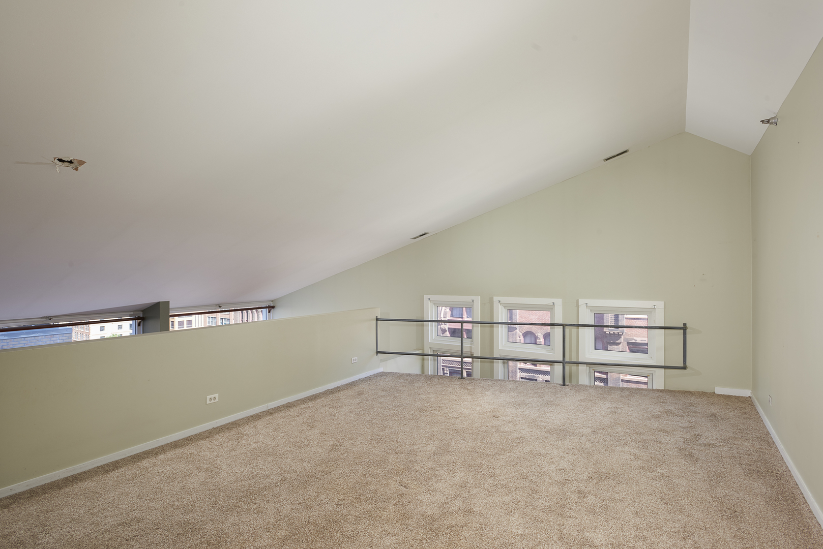 714 South Dearborn Street, Unit 9PH Chicago, IL 60605 - Photo 12 of 26 a view of a room with racks on the wall
