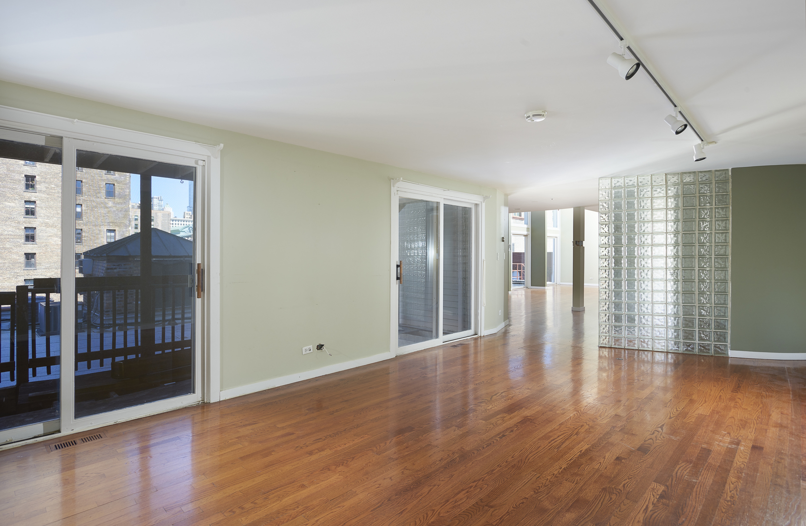 714 South Dearborn Street, Unit 9PH Chicago, IL 60605 - Photo 9 of 26 a view of an empty room with glass door