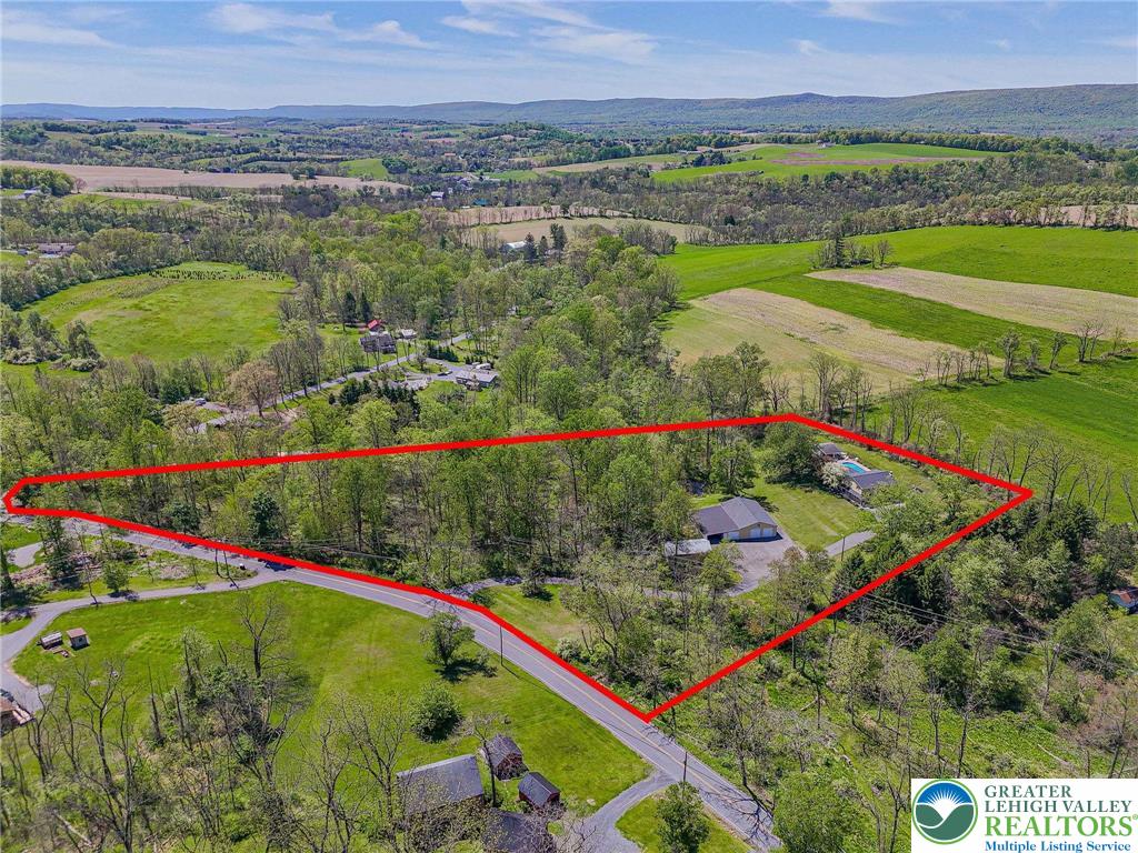 3857 Friedens Road Slatington, PA 18080 - Photo 9 of 75 This aerial view showcases a secluded property nestled amidst expansive natural beauty.