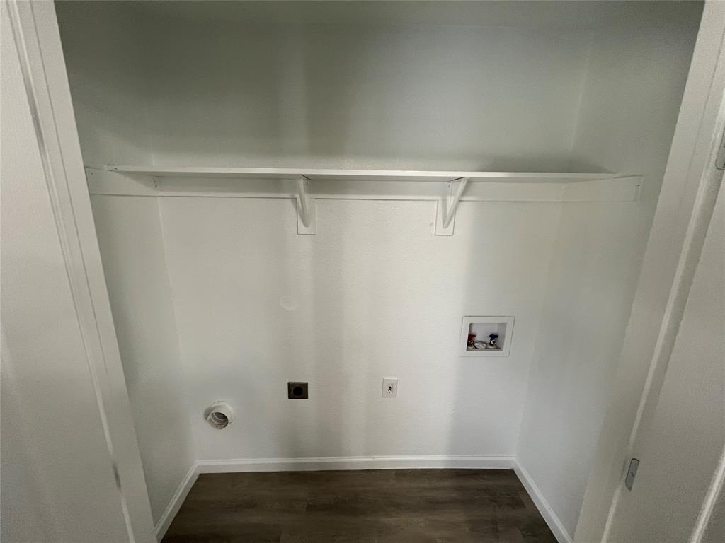 7642 Maxwell Avenue Dallas, TX 75217 - Photo 10 of 20 Laundry area featuring electric dryer hookup, dark wood finished floors, and hookup for a washing machine