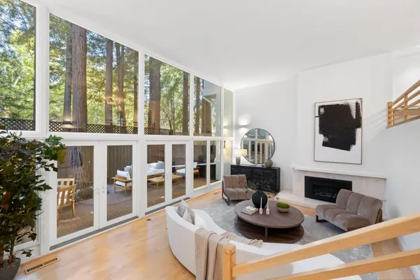 a living room with furniture and a fireplace