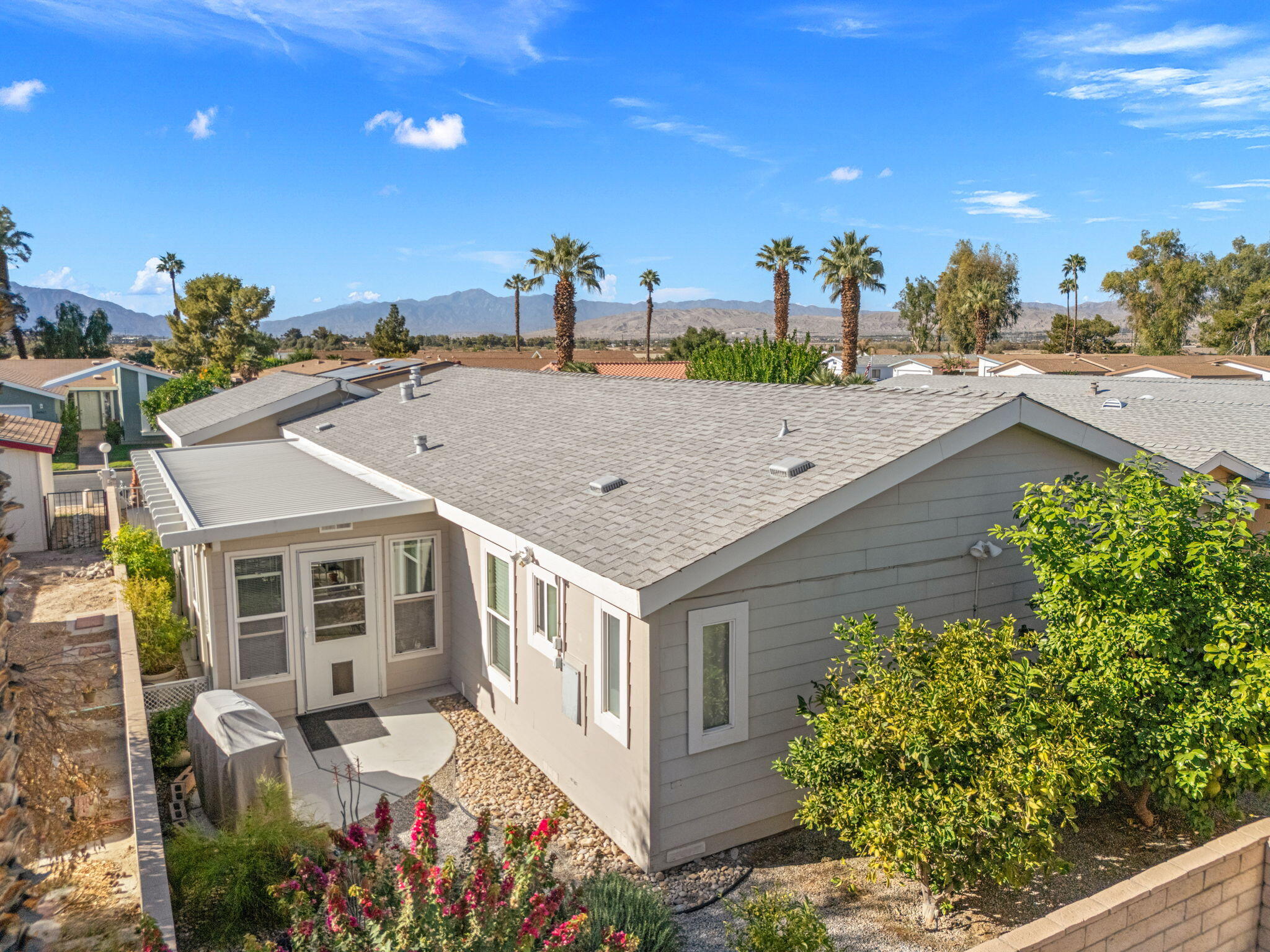 34960 Serenade Thousand Palms, CA 92276 - Photo 11 of 50 a view of a house with a garden
