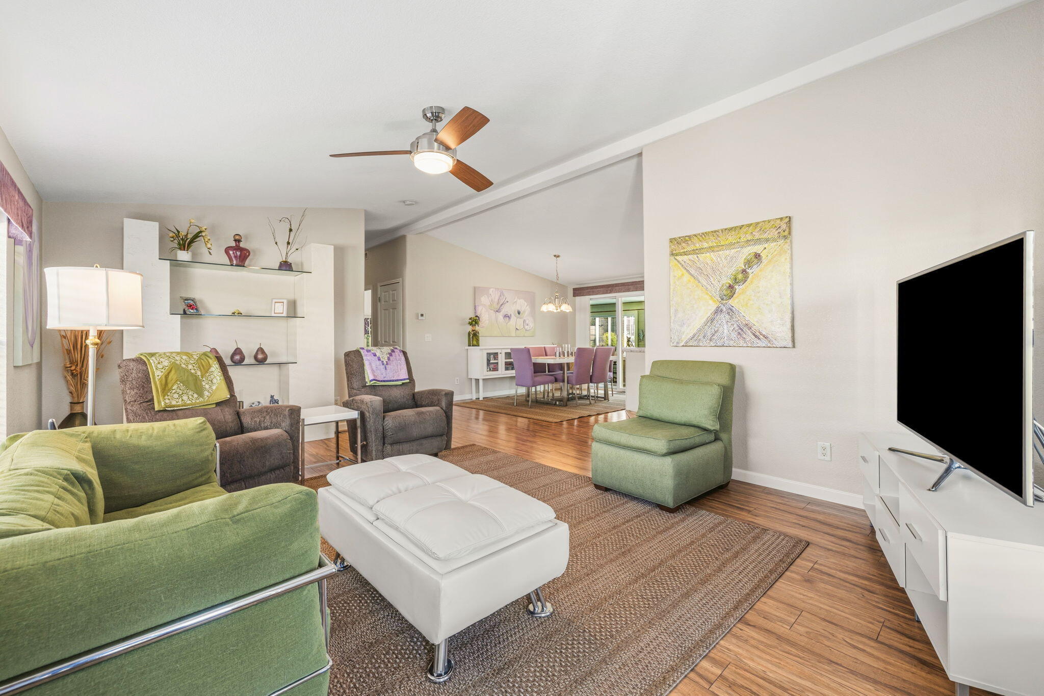 34960 Serenade Thousand Palms, CA 92276 - Photo 13 of 50 a living room with furniture and a flat screen tv