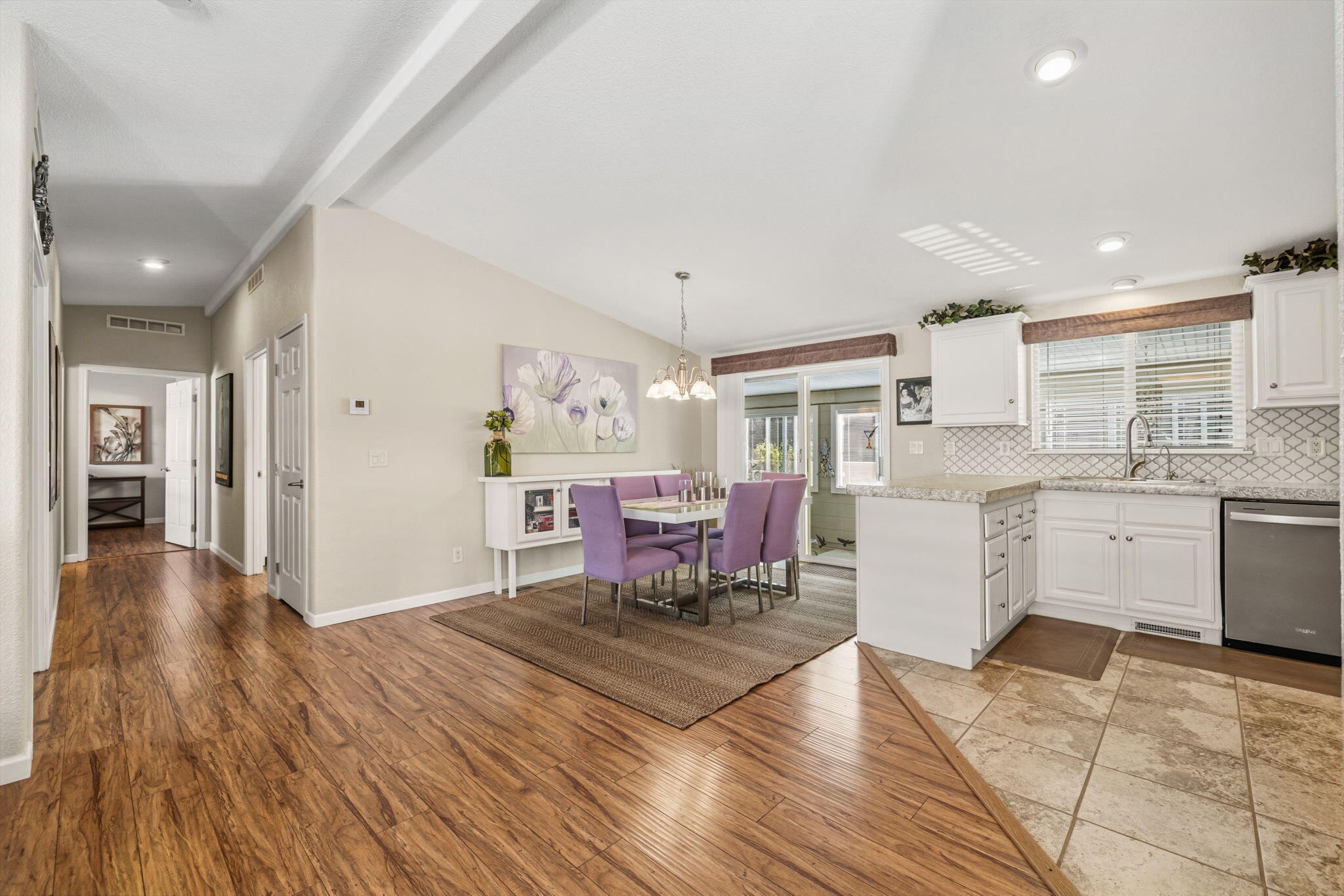 34960 Serenade Thousand Palms, CA 92276 - Photo 14 of 50 a kitchen with stainless steel appliances kitchen island granite countertop a sink cabinets and wooden floor