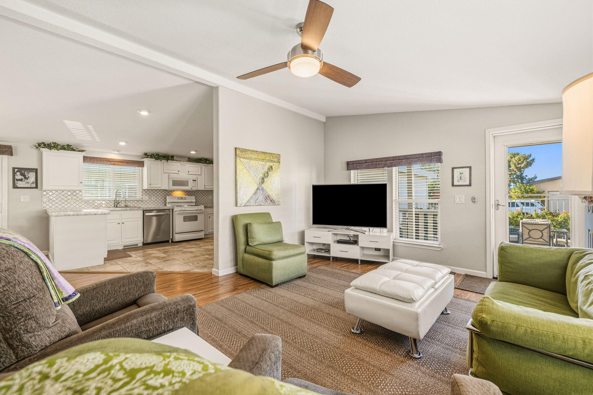 34960 Serenade Thousand Palms, CA 92276 - Photo 15 of 50 a living room with furniture and a flat screen tv