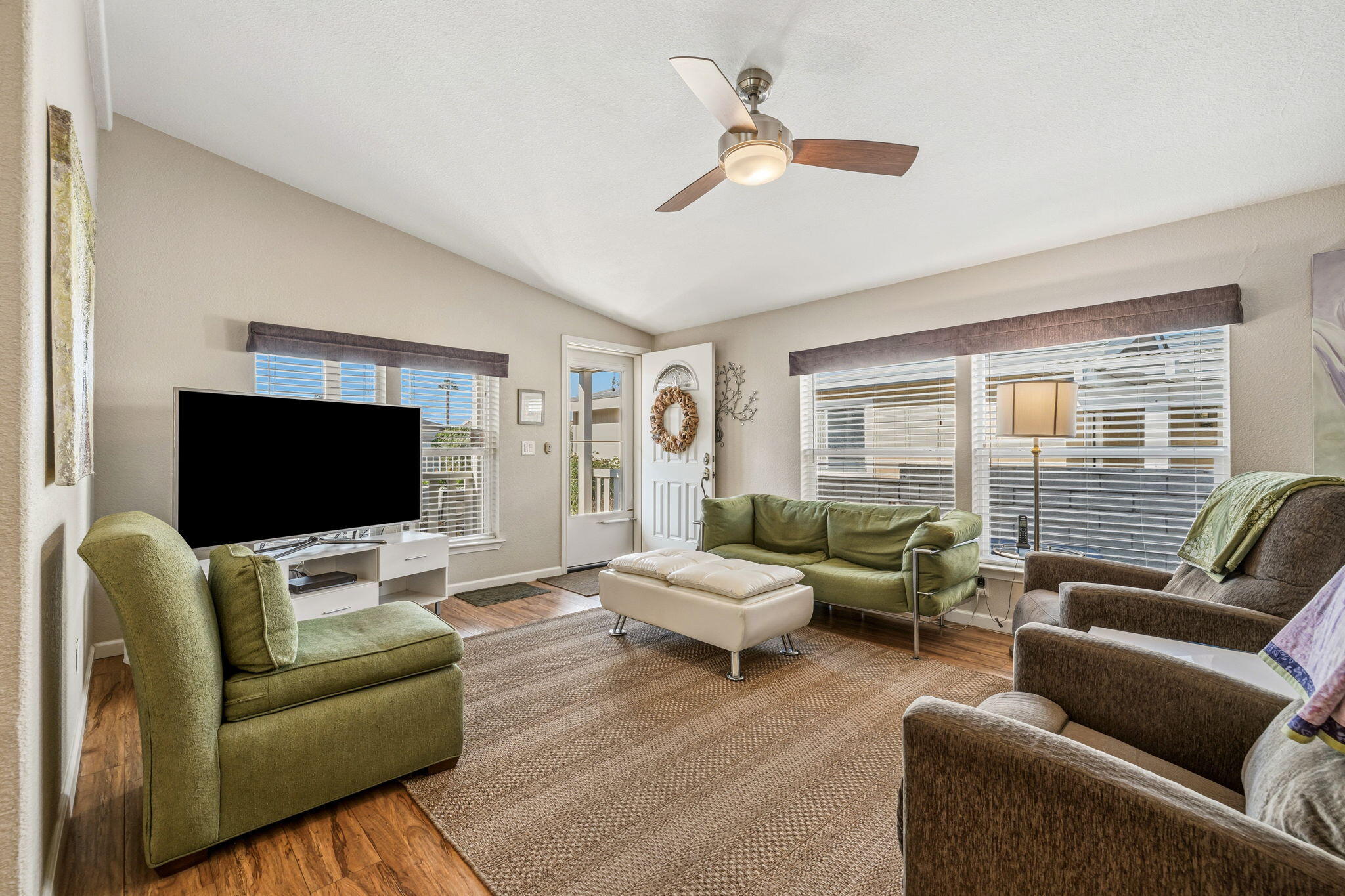 34960 Serenade Thousand Palms, CA 92276 - Photo 16 of 50 a living room with furniture and a flat screen tv