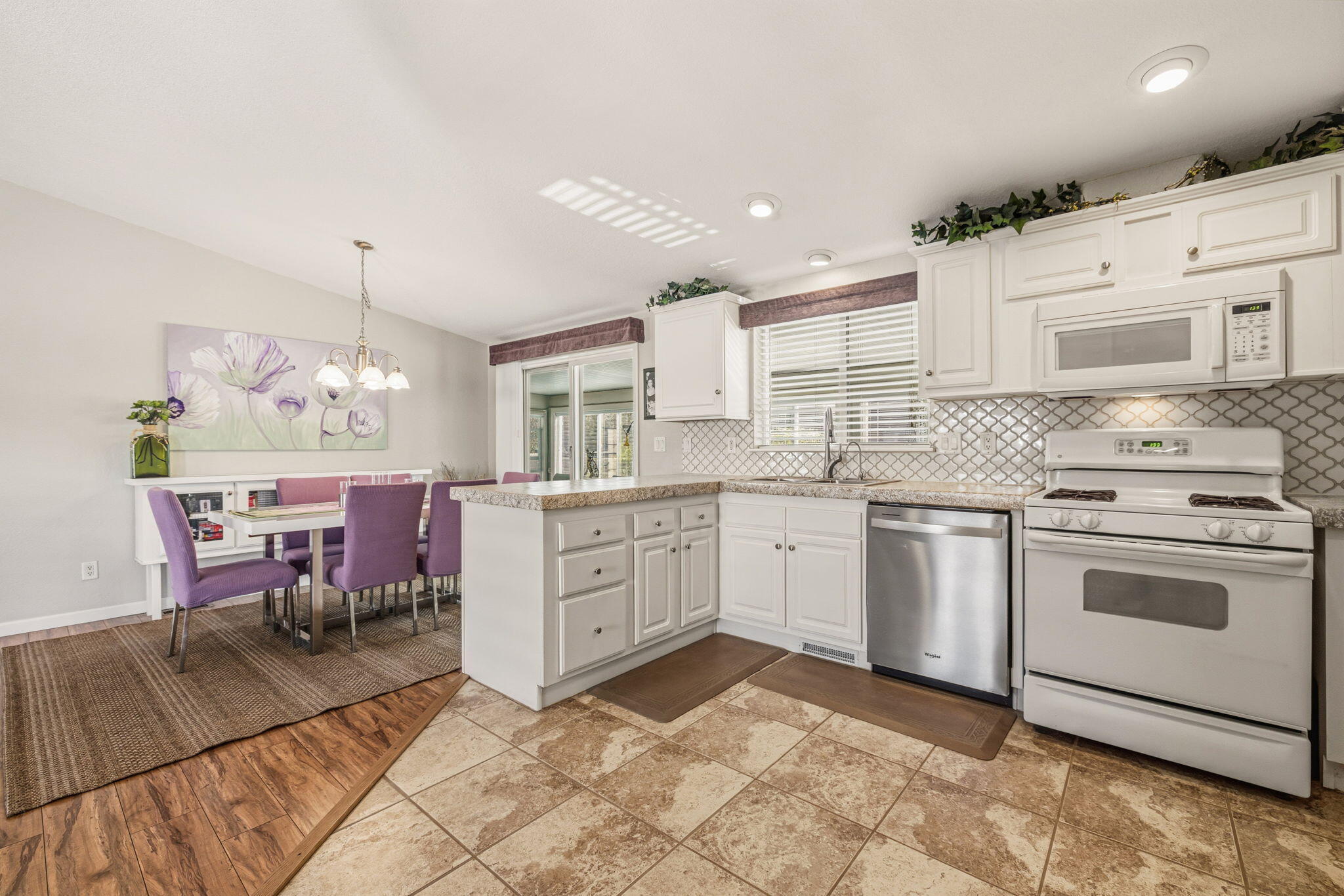 34960 Serenade Thousand Palms, CA 92276 - Photo 19 of 50 a kitchen with a stove a sink and a refrigerator