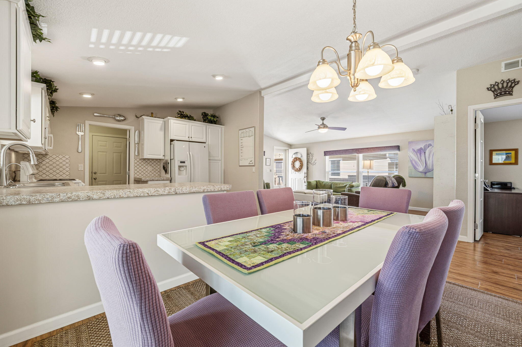 34960 Serenade Thousand Palms, CA 92276 - Photo 23 of 50 a view of a dining room with furniture a chandelier and wooden floor