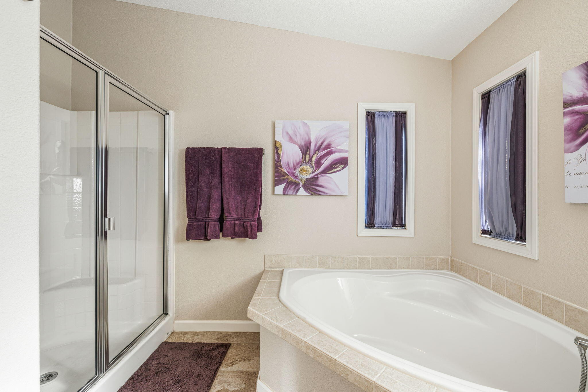 34960 Serenade Thousand Palms, CA 92276 - Photo 27 of 50 a bathroom with a bathtub and a shower