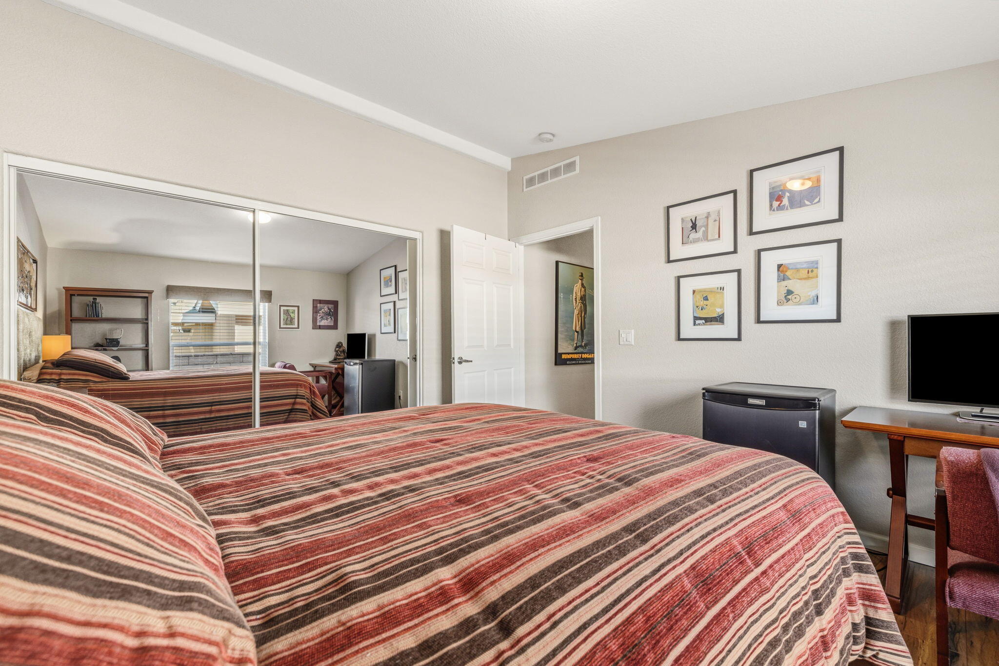 34960 Serenade Thousand Palms, CA 92276 - Photo 29 of 50 a bedroom with a bed and a flat screen tv